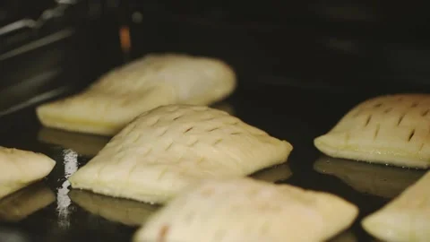 Timelapse bun baking in electric oven close up Pastry production process Stock Footage 336576464