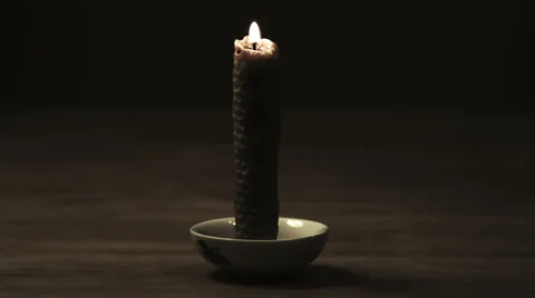 Timelapse of a burning candle made of natural honeycombs Stock Footage 34681987