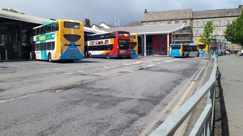 Timelapse of buses arriving and leaving UK bus station Stock Footage 245212170