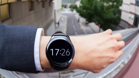 Timelapse of a businessman checking the time on a smartwatch Stock Footage 104048722