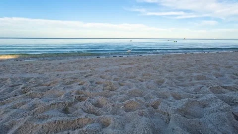 Timelapse of Busy Beach with Clouds Rolling By Stock Footage 310804359