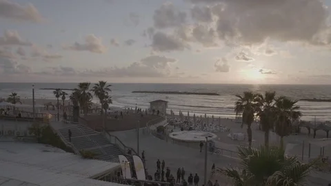 Timelapse of busy beach at sunset Stock Footage 82831140