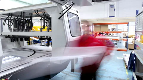 Timelapse of busy factory workers operating machinery Stock Footage 32934004