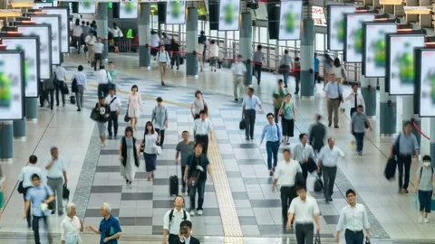 Timelapse of Busy Station at Rush Hour in Tokyo -Zoom Out- Stock Footage