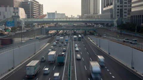 Timelapse busy traffic highway between Tokyo buildings Stock Footage 116636819