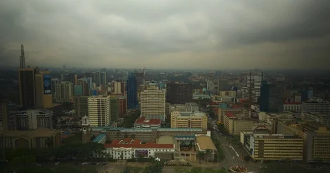 Timelapse of a busy traffic intersection in Nairobi on a cloudy day from a Stock Footage 81587907