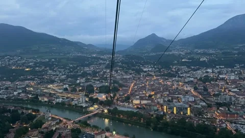 Timelapse of a cable car ride over the city with mountains behind, Trento, .. Video stock 328204466