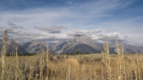 Timelapse with Camera Moving Revealing the  Towering Peaks of the Grand Tetons Stock Footage 258185611