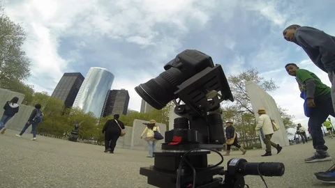 Timelapse of camera surrounded by people in big city, day Stock Footage 99176436