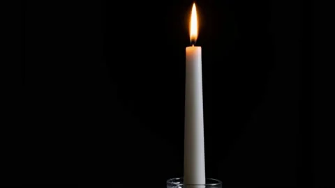 Timelapse candle is lit on a black background Stock Footage 132712231