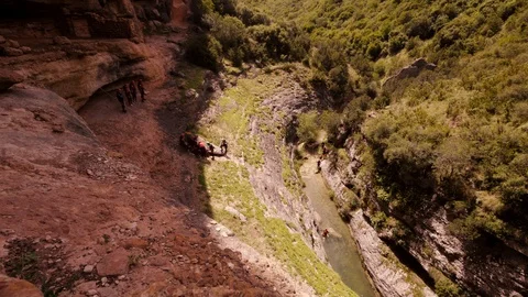 Timelapse of a Canyoning group abseiling one after another into a Canyon Stock Footage 98178628