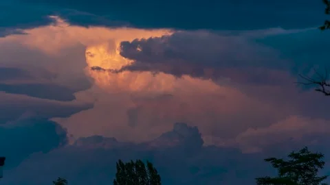 This timelapse captures fiery storm clouds near Zurich, Switzerland at sunset Stock Footage 301536991