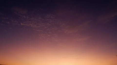 A timelapse captures the sunrise sky. Stock Footage 306103699