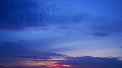 A timelapse captures the sunrise sky, Time-lapse footage. Stock Footage 303539486