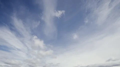 Timelapse capturing the clouds across a vibrant blue sky, highlighting dramatic Stock Footage 330376702