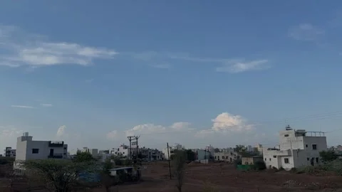 Timelapse capturing fluffy cotton clouds moving rapidly overhead 4k Stock Footage 337147950