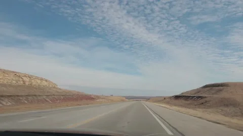 Timelapse of car driving through valley area on highway Stock Footage 57401933