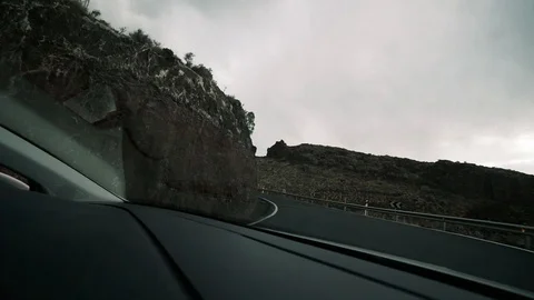 Timelapse from a car, through a windshield - a highway in the mountains, a Stock Footage 116706624