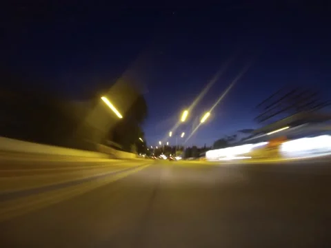 Timelapse from car while driving around empty town streets Stock Footage 132444725