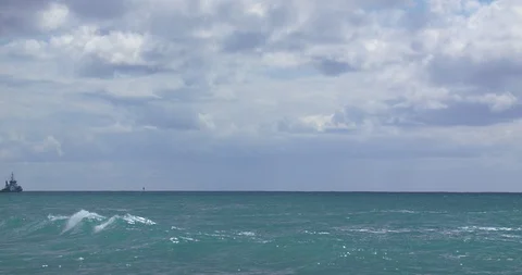 Timelapse of a Cargo Ship Being Ferried out of Barbers Point Harber in Ohau Stock Footage 104427803