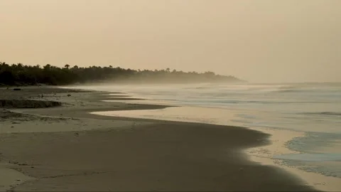 Timelapse of Casamance beach after sunset. Blurred waves, and drifting mist Stock Footage 309913342