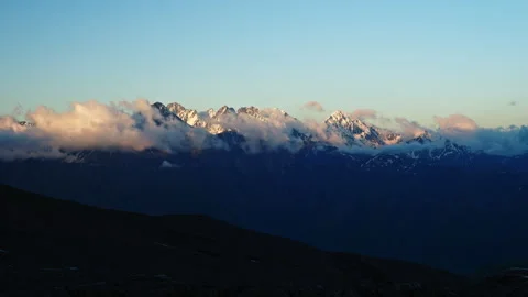 Timelapse of Caucasus mountain ridge with clouds moving over snowy peaks Stock Footage 280494011