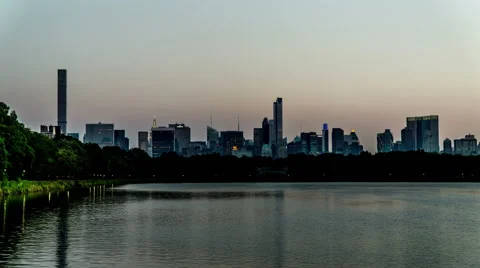 Timelapse of the Central Park and modern buildings looking Stock Footage 63990045