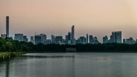 Timelapse of the Central Park and modern buildings looking Stock Footage 63990948
