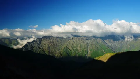 Timelapse of changing clouds over Caucasus mountain ridge in daylight. Majestic Stock Footage 280290959