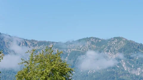 Timelapse, changing shape and texture of clouds against the backdrop of alpine m Stock Footage 286415210