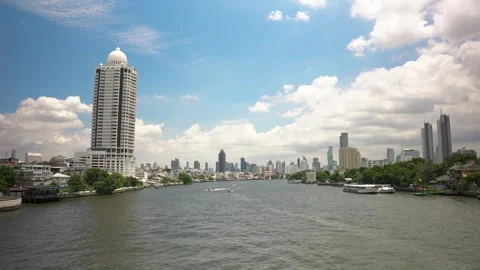 Timelapse of Chao Phraya River with ferries and boats. Panoramic cityscape of Stock Footage 254742346