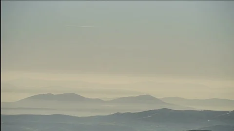 Timelapse of Chinese style mountains. Rolling hills with fog, mist at sunset Stock Footage 117953445