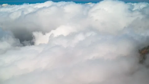 Timelapse of churning boiling clouds shot with telephoto lens, mountain slope, T Stock-Footage 335765031