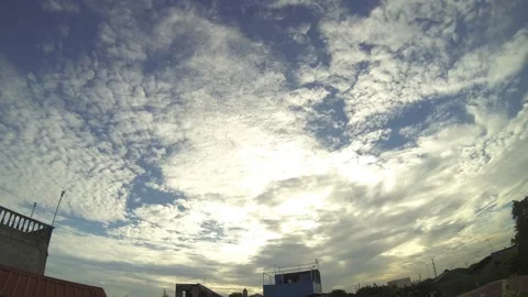 Timelapse of Cirrocumulus Clouds over an urban area Stock Footage 134031974
