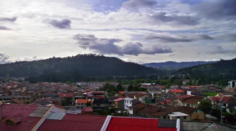 Timelapse of the city of Cuenca, Ecuador with rolling clouds in the distance. Stock Footage 52321053