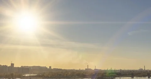 Timelapse of city life. Sun rays, blue sky, river and bridge over horizont Stock Footage 128974166