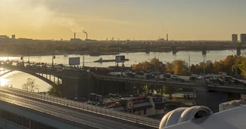 Timelapse of city life. Sun rays, blue sky, river and bridge over horizont Stock Footage 138817342