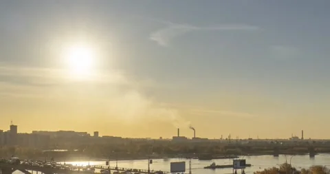 Timelapse of city life. Sun rays, blue sky, river and bridge over horizont Stock Footage 152586514