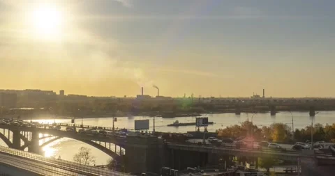 Timelapse of city life. Sun rays, blue sky, river and bridge over horizont Stock Footage 152586660
