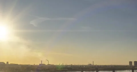 Timelapse of city life. Sun rays, blue sky, river and bridge over horizont Stock Footage 169654687