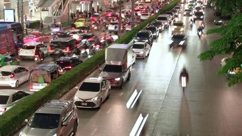 Timelapse of the city multilane road with many cars and motorcycles at rush hour Stock Footage 254742367