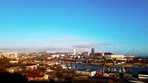Timelapse cityscape with a view of the Russian bridge and port. Video stock 127735304