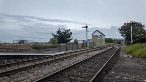 Timelapse of classic coal train on old railway tracks and fast moving clouds Stock Footage 317139372