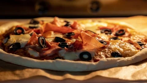 Timelapse of classic Italian pizza baking in an oven. Trucking camera motion Stock Footage 143099863