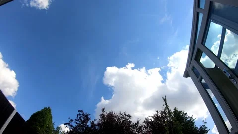 Timelapse of a Clear Blue Sky with Fluffy White Clouds 스톡 동영상 220086809