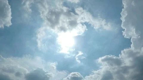 Timelapse of Clear Blue Sky with White Clouds and Sunlight Shining Through Stock Footage 90039360