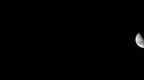 Timelapse on a clear night of half moon going right to left of screen. 動画素材 11276851