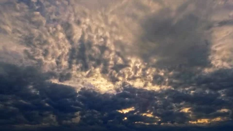 Timelapse clip of massive gray snow or rain clouds at sundown 動画素材 252919953