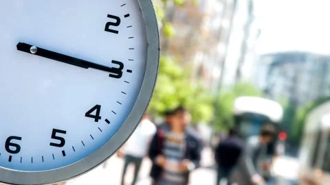 Timelapse of Clock time in front busy city street people passing by backgro.. Stock Footage 272761113