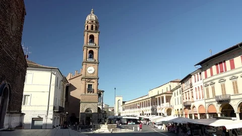 Timelapse of clock tower overlooking street market, ungraded Stock Footage